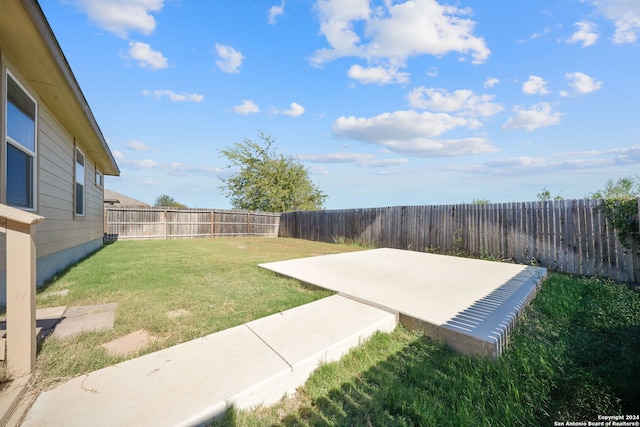 view of yard with a patio area and a fenced backyard