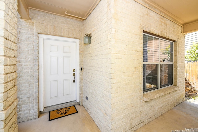 entrance to property with brick siding