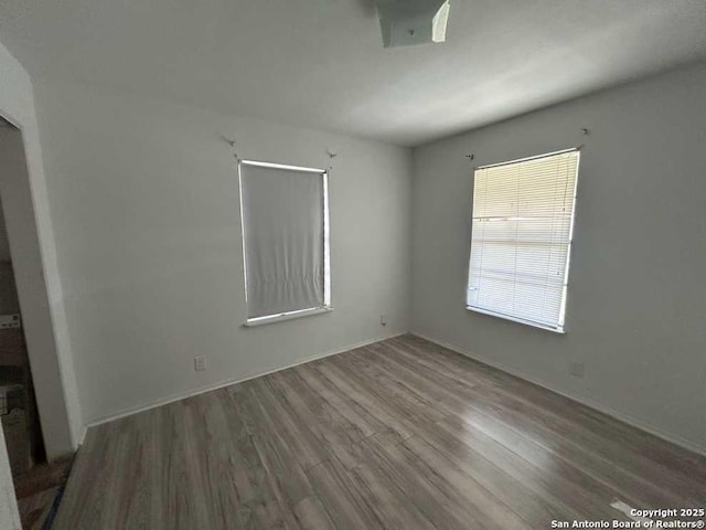 empty room featuring wood finished floors