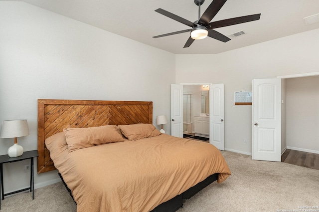 bedroom with visible vents, baseboards, connected bathroom, ceiling fan, and carpet