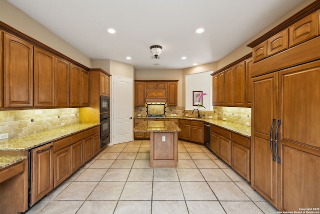 37 Westerleigh, San Antonio, TX 78218 - kitchen with black appliances, decorative backsplash, brown cabinetry, light stone countertops, and recessed lighting