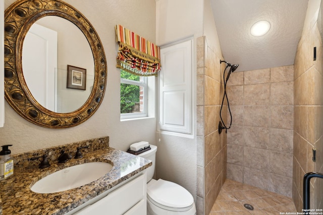 37 Westerleigh, San Antonio, TX 78218 - bathroom featuring a stall shower, vanity, toilet, and a textured ceiling