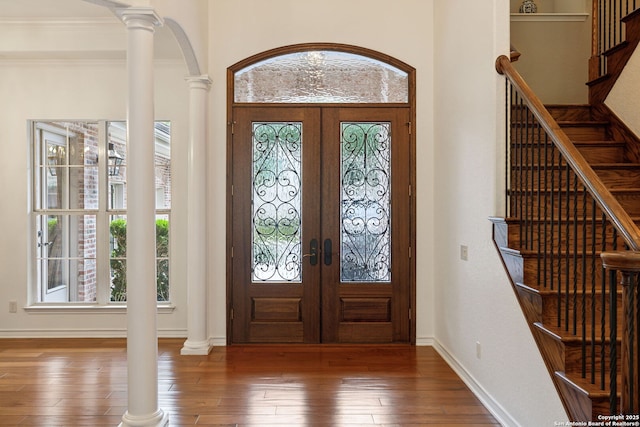 37 Westerleigh, San Antonio, TX 78218 - foyer entrance with ornate columns, healthy amount of natural light, stairway, wood-type flooring, and crown molding