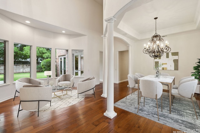 37 Westerleigh, San Antonio, TX 78218 - dining area with decorative columns, arched walkways, wood-type flooring, a chandelier, and ornamental molding