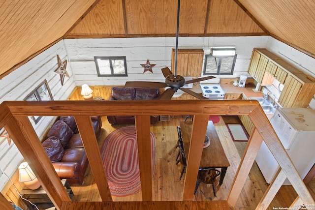 interior space with wood ceiling, wooden walls, and wood finished floors