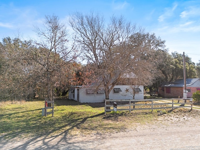 view of front of property with fence and a front yard