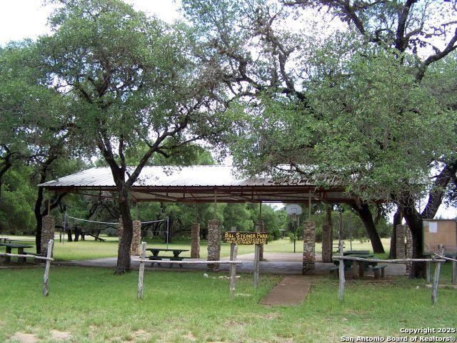 surrounding community with a yard, a carport, and a gazebo