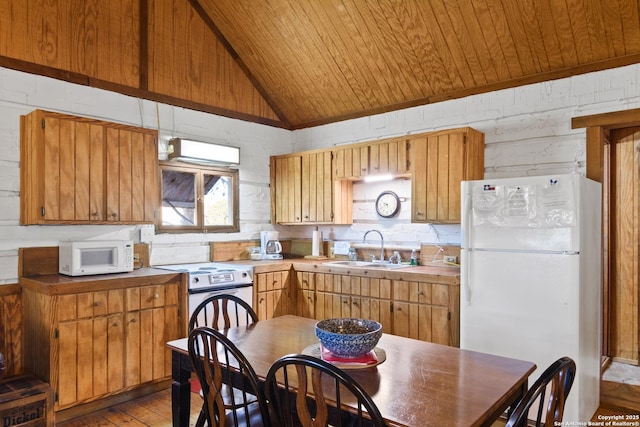 kitchen with wooden ceiling, light wood-style floors, vaulted ceiling, a sink, and white appliances