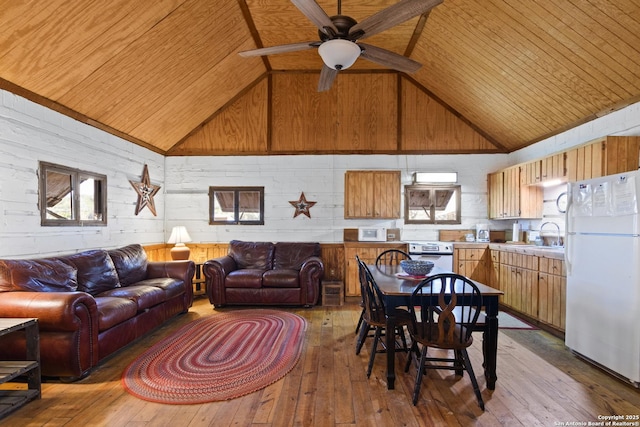 living room with wood ceiling, wood-type flooring, high vaulted ceiling, and a ceiling fan