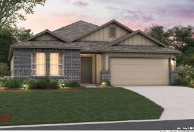 craftsman-style home with driveway, a lawn, an attached garage, and board and batten siding
