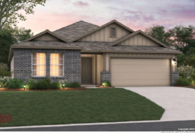 view of front facade with brick siding, concrete driveway, board and batten siding, a front yard, and a garage