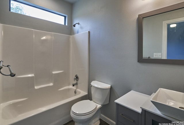 full bathroom with a textured wall, shower / bathing tub combination, vanity, and toilet