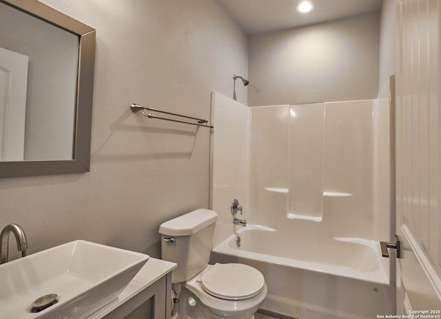 bathroom with shower / bathing tub combination, vanity, and toilet