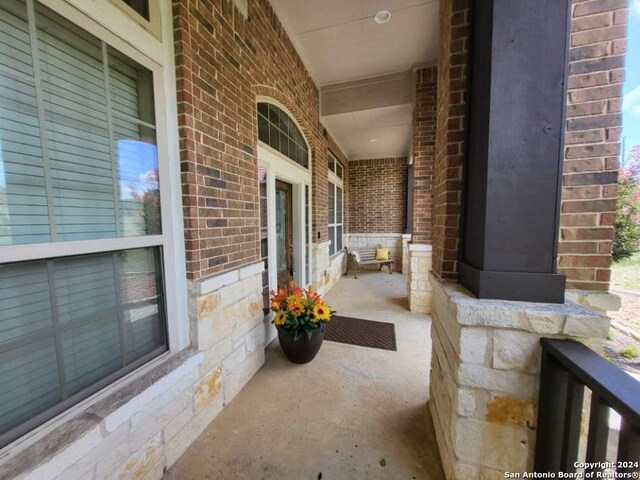 view of patio featuring a porch