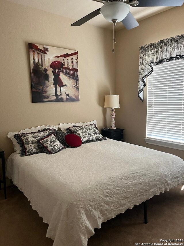 bedroom with carpet floors and a ceiling fan