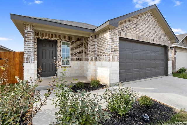 view of front facade featuring a garage, fence, concrete driveway, and brick siding