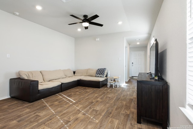 living room featuring ceiling fan, recessed lighting, vaulted ceiling, and wood finished floors