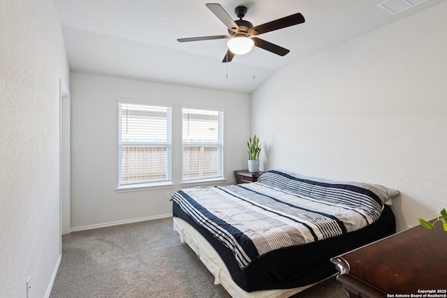 carpeted bedroom with lofted ceiling, a ceiling fan, visible vents, and baseboards