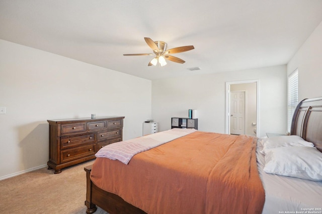 bedroom featuring light colored carpet, ceiling fan, visible vents, and baseboards