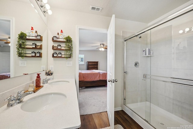 full bath featuring ensuite bathroom, a sink, and visible vents