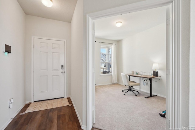 interior space featuring carpet and baseboards