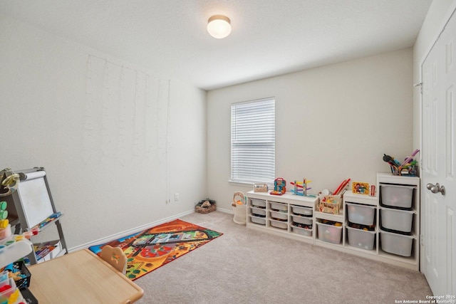 game room with carpet floors and baseboards