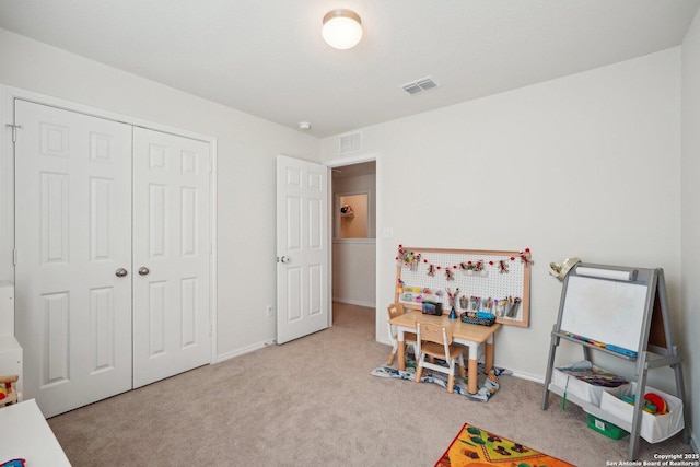 playroom with carpet floors, visible vents, and baseboards