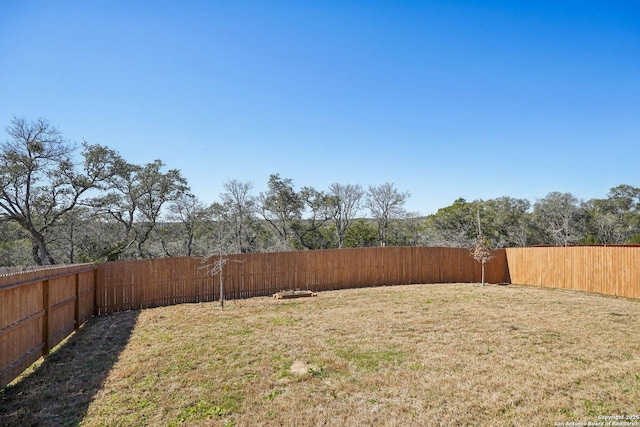 view of yard featuring a fenced backyard