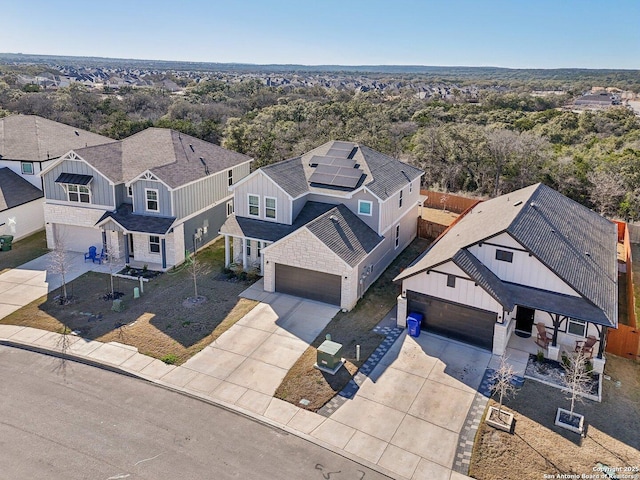 birds eye view of property with a wooded view