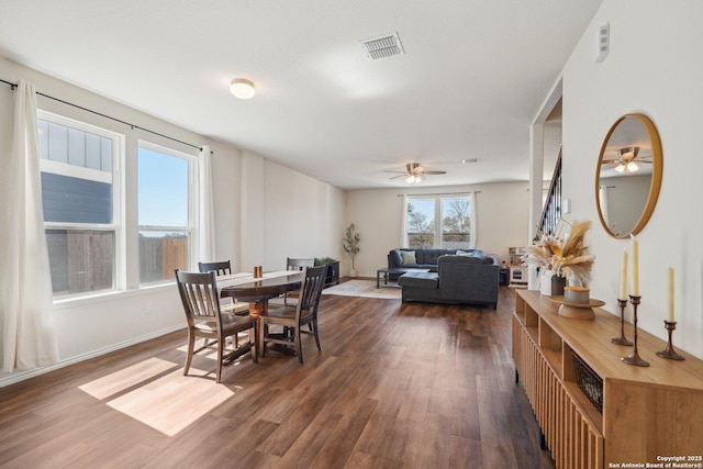 dining area with ceiling fan, visible vents, dark wood finished floors, and baseboards