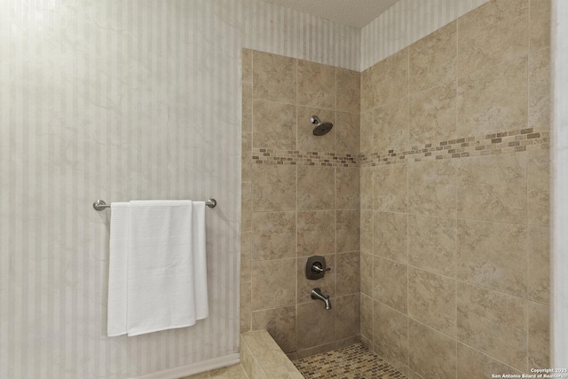 bathroom featuring tiled shower