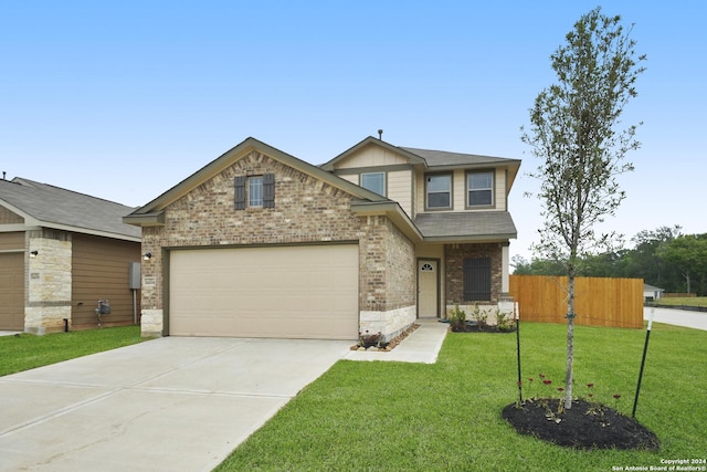 view of front of house featuring an attached garage, brick siding, fence, driveway, and a front lawn