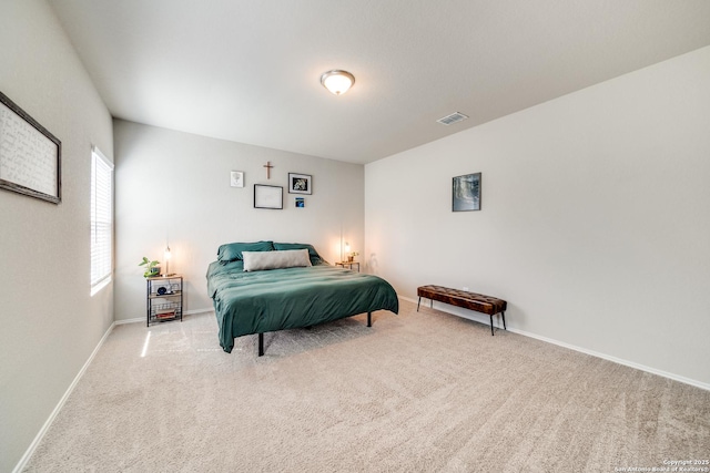 bedroom featuring carpet flooring, visible vents, and baseboards