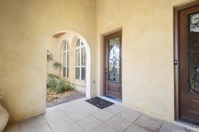 doorway to property with stucco siding