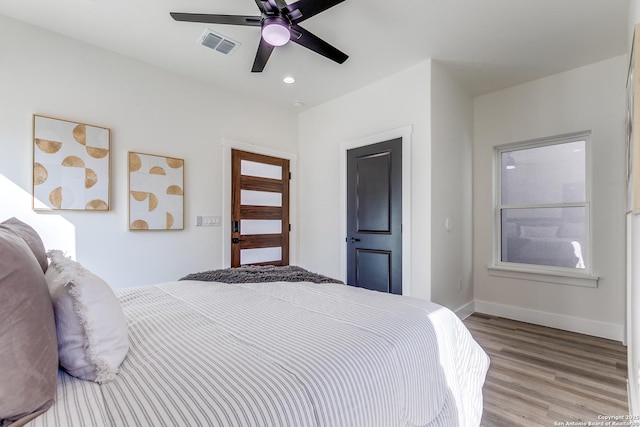 bedroom featuring baseboards, visible vents, ceiling fan, wood finished floors, and recessed lighting