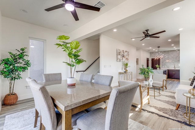 dining area with ceiling fan, recessed lighting, visible vents, stairway, and light wood-type flooring