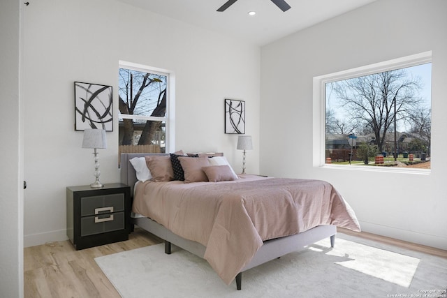 bedroom with light wood-style floors, baseboards, a ceiling fan, and recessed lighting