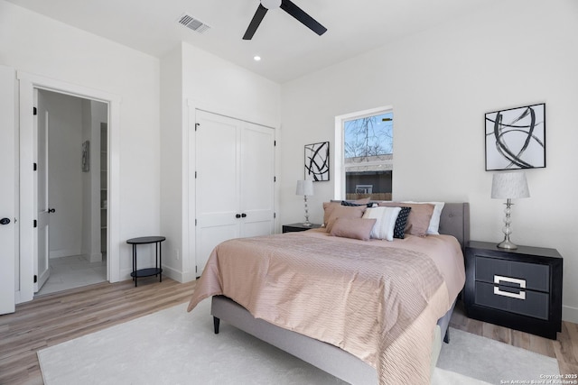 bedroom with visible vents, a ceiling fan, light wood-style flooring, a closet, and recessed lighting