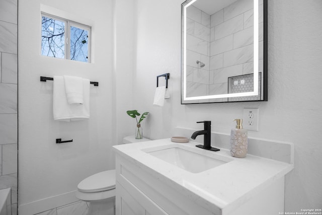 full bath with a shower, marble finish floor, toilet, vanity, and baseboards