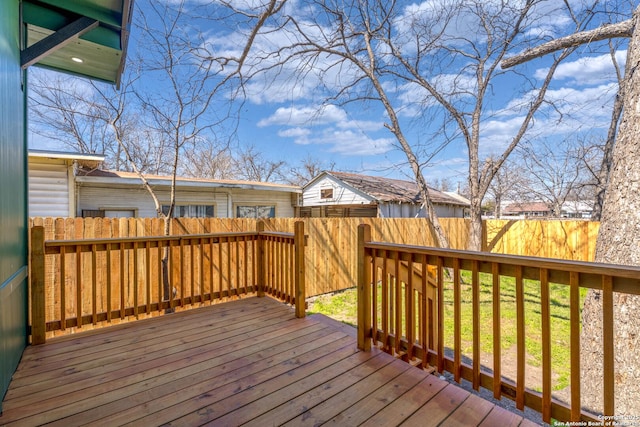 wooden deck featuring fence