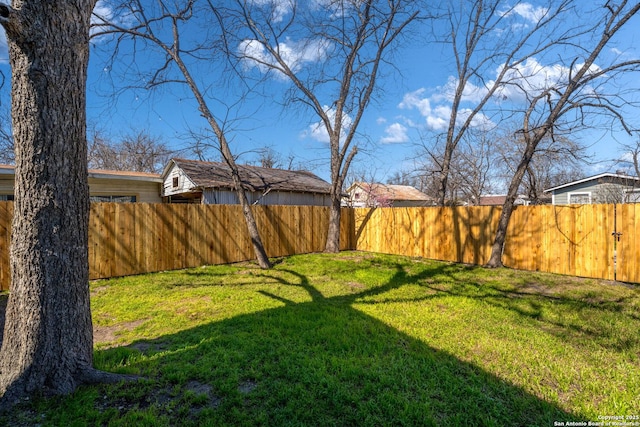 view of yard with a fenced backyard