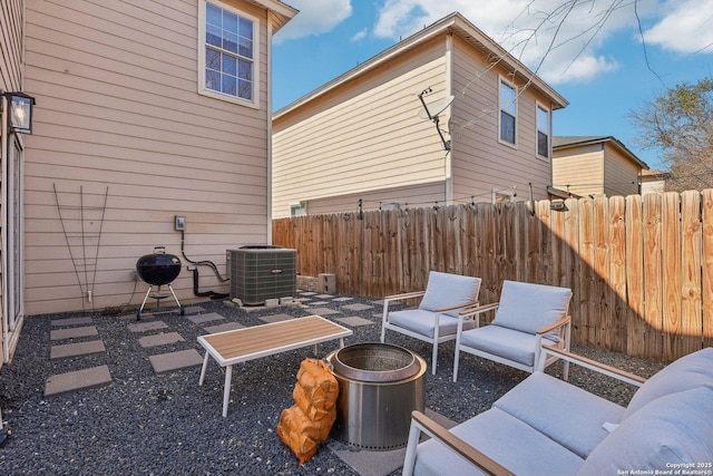 view of patio featuring fence and central AC