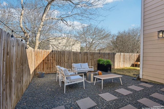 view of patio featuring a fenced backyard and an outdoor hangout area