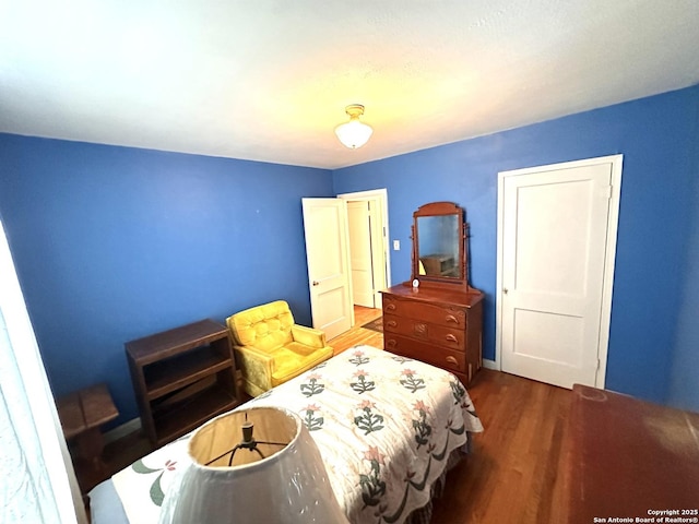 bedroom featuring wood finished floors