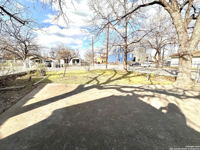 view of yard with fence and a residential view