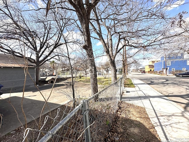 view of road with a residential view and sidewalks