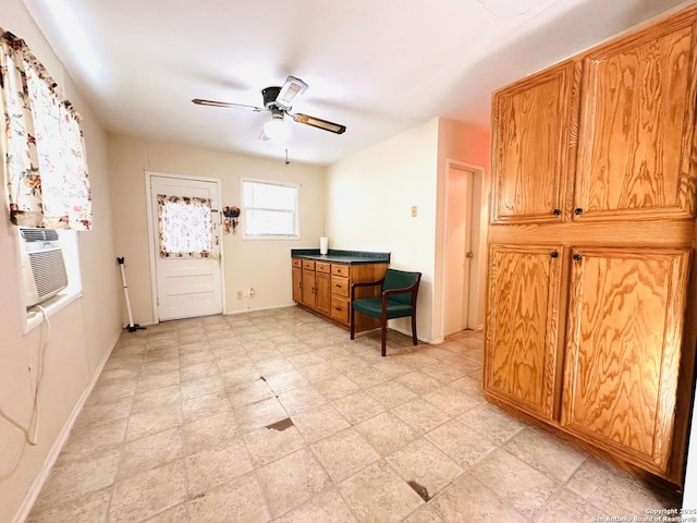 entrance foyer featuring light floors, cooling unit, baseboards, and a ceiling fan