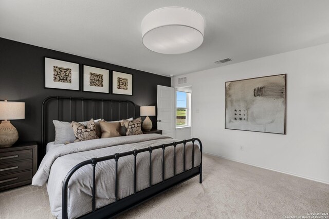 bedroom featuring baseboards, visible vents, and carpet flooring