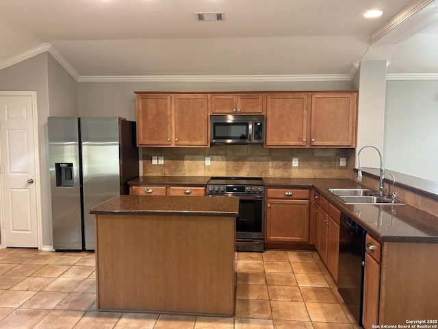 kitchen with stainless steel appliances, a sink, visible vents, tasteful backsplash, and crown molding