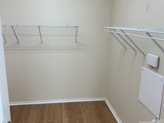 spacious closet with wood finished floors